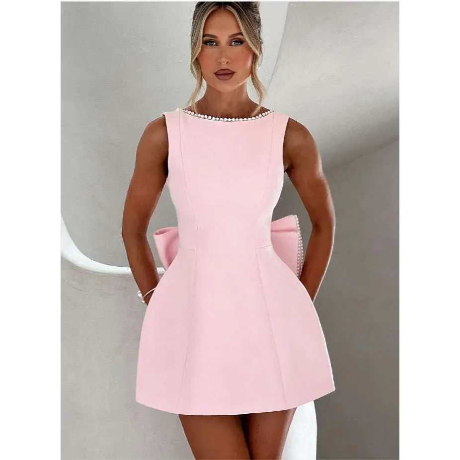 A pink sleeveless backless dress summer style with pearl embellished neckline and white satin back waistband detail