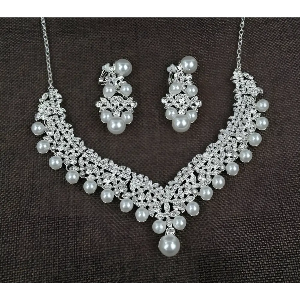 Silver white pearl necklace diamond suit bridal set with intricate crystal embellishments and matching earrings