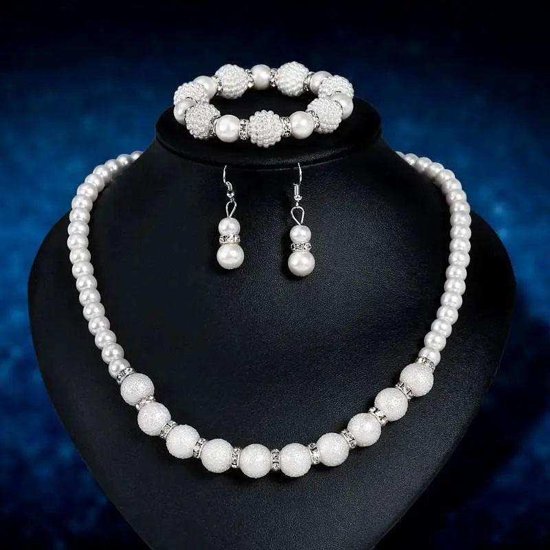 White pearl wedding necklace with textured spherical beads and silver toned accents for wedding earrings necklace set