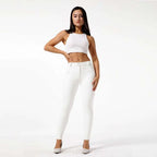 White pu leather high waisted skinny pants with sleek form fitting design and subtle front pockets