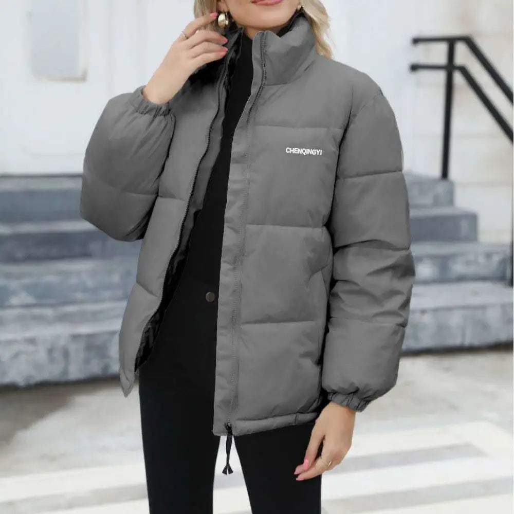 Gray puffer winter coat for women casual windproof wear with high collar and white embroidered branding on chest