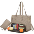 Beige quilted insulated lunch bag with leather trim, detachable shoulder strap, and front zipper pocket for groceries