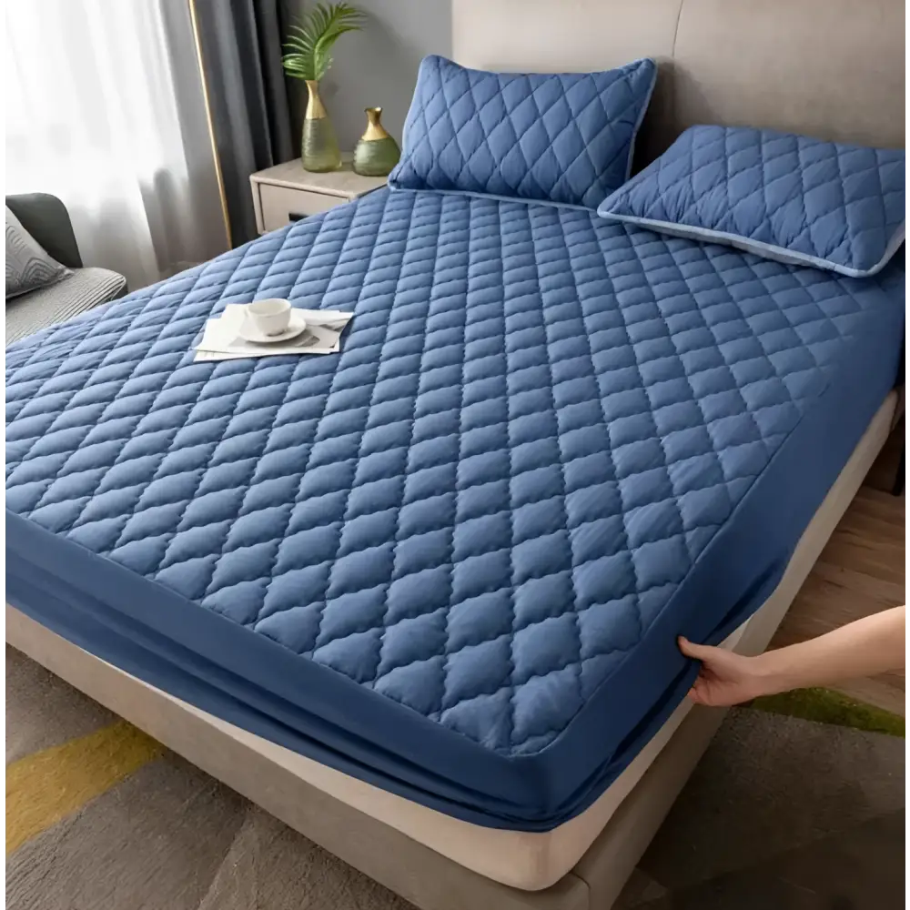 White quilted waterproof mattress protector for kids with diamond pattern for water resistance and comfort