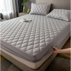 Gray quilted waterproof mattress protector with diamond pattern and elastic edge for kids white quilted waterproof use