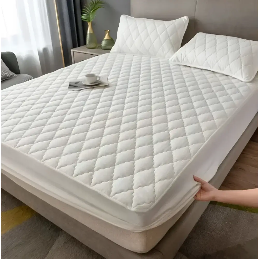 White quilted waterproof mattress protector with diamond pattern designed for kids with durable waterproof fabric