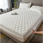 White quilted waterproof mattress protector with diamond pattern designed for kids providing waterproof protection