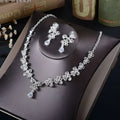 Silver floral white rhinestone necklace earrings set with clear crystal accents and matching butterfly design