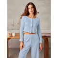 Light blue ribbed knit pajama set with button-front top and matching pants complementing white ribbed knit fashion cardigan