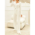 White ribbed knit fashion cardigan with long sleeves front button closure and subtle vertical pleats