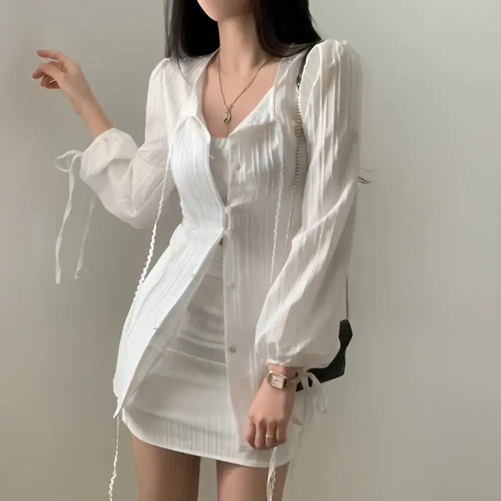 White ribbed long sleeve shirt dress with sheer sleeves and tie waist detail for a stylish sleeve shirt dress