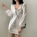 White ribbed long sleeve shirt dress featuring tie waist and tie details at the cuffs for a stylish look