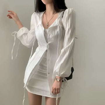 White ribbed long sleeve shirt dress featuring tie waist and tie details at the cuffs for a stylish look
