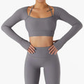 Gray ribbed long sleeve sports bra featuring chest pad slim with thin shoulder straps and matching high-waisted leggings