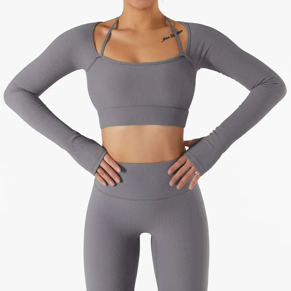 Gray ribbed long sleeve sports bra featuring chest pad slim with thin shoulder straps and matching high-waisted leggings
