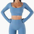 A matching blue ribbed long sleeve workout set featuring chest pad slim crop top with thin straps and high waisted leggings
