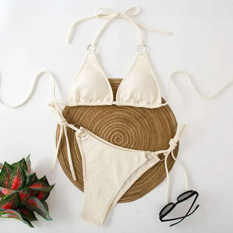Cream-colored ribbed sexy bikini set with adjustable tie thong bandage and silver ring accents for stylish swimwear