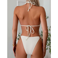 Cream-colored ribbed sexy bikini set with tie thong bandage halter top tied at the back and gold ring accents