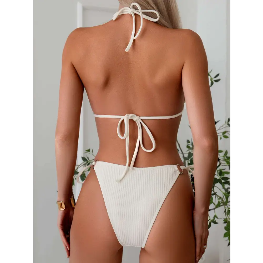 Cream-colored ribbed sexy bikini set with tie thong bandage halter top tied at the back and gold ring accents