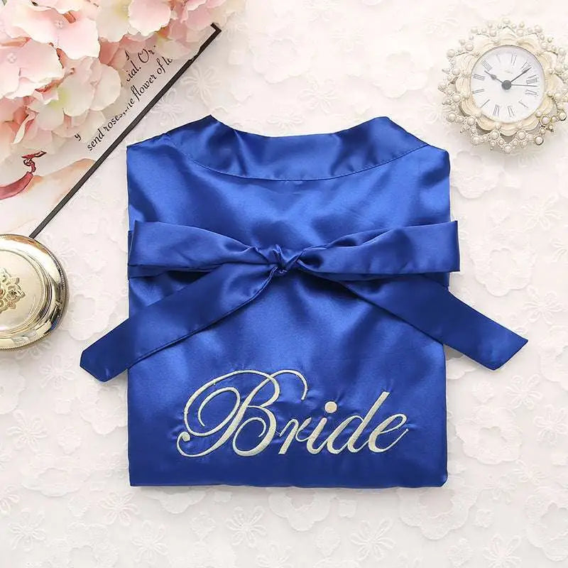 Royal blue satin bridal pajamas simulation with silver embroidered bride lettering and matching bow in simulation silk nightgown