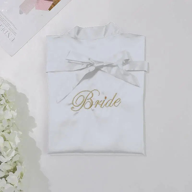 White satin bridal pajamas simulation with gold embroidered bride script and matching ribbon bow waist tie silk nightgown