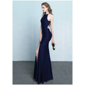 A sleek navy blue floor-length gown with side cutouts high neckline and thigh-high slit evening dress