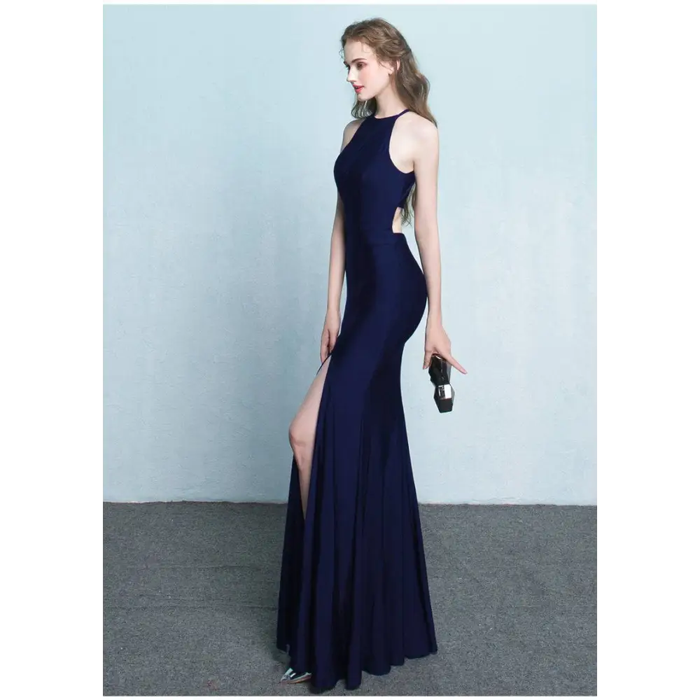 A sleek navy blue floor-length gown with side cutouts high neckline and thigh-high slit evening dress