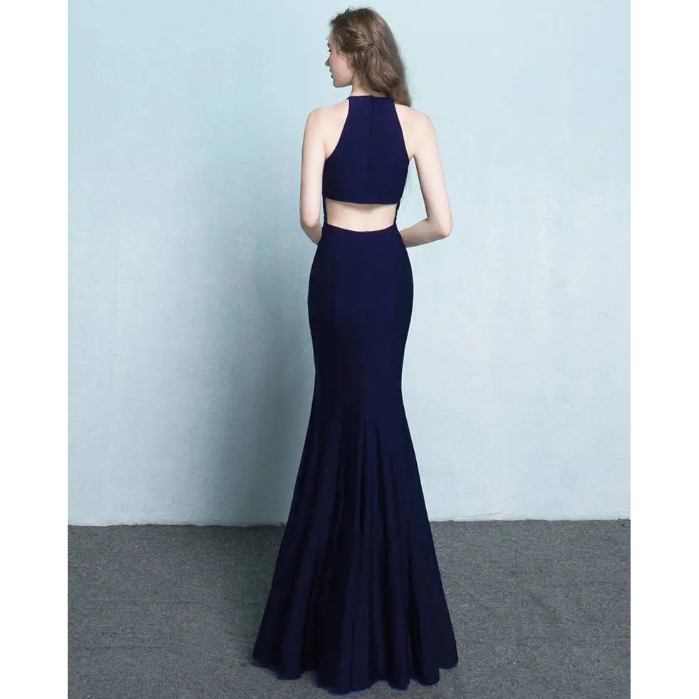 Navy blue mermaid-style two-piece gown with halter neckline and cutout back, styled as white satin halter neck evening dress
