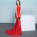 A striking red satin mermaid gown with high neckline and dramatic train as a white satin halter neck evening dress alternative