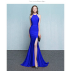 A striking royal blue satin mermaid gown with a high neckline and thigh-high slit for formal evening events