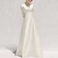 Elegant white satin wedding dress with satin v neck, three quarter sleeves, and long skirt for formal occasions