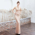 A shimmering rose gold sequin mermaid evening dress with a halter neckline made of white sequin polyester fiber