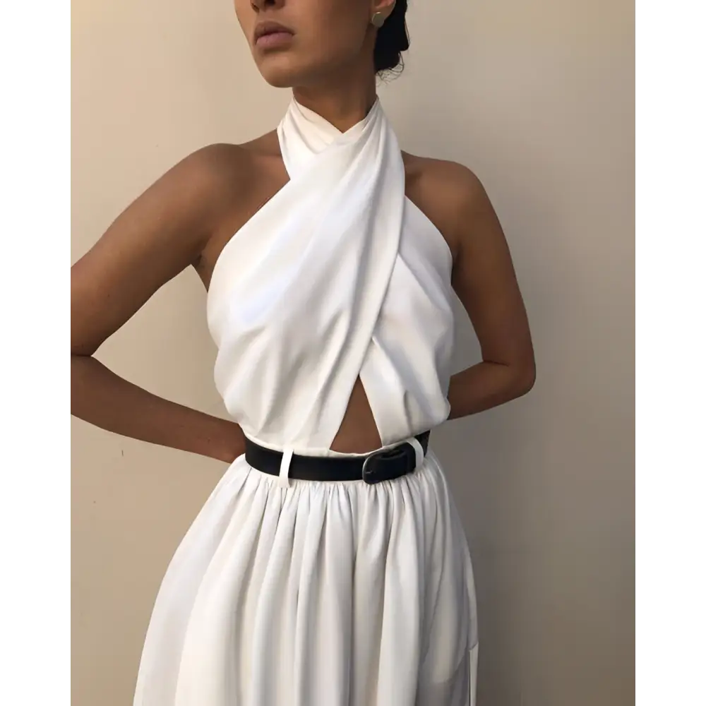 White sexy sleeveless halter backless jumpsuit with flowing white fabric draped asymmetrical neckline and black belt waist