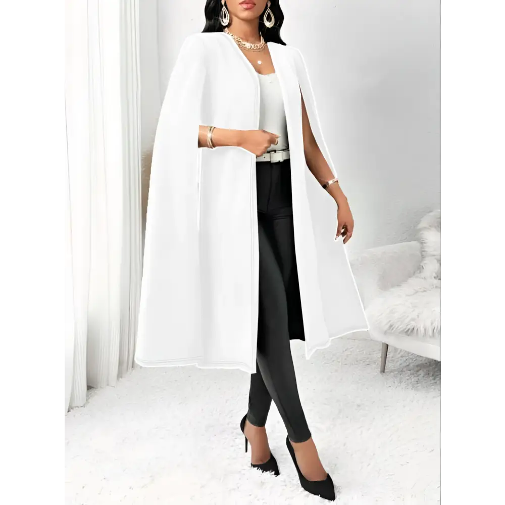 White sleeveless casual fit cape vest featuring a flowing open front and wide sleeves for elegant layering