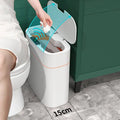 White smart trash can with sleek modern design and orange accent stripe for living room and kitchen use