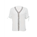 White blouse with short sleeves and v-neckline featuring black solid color leopard print collar and front placket trim