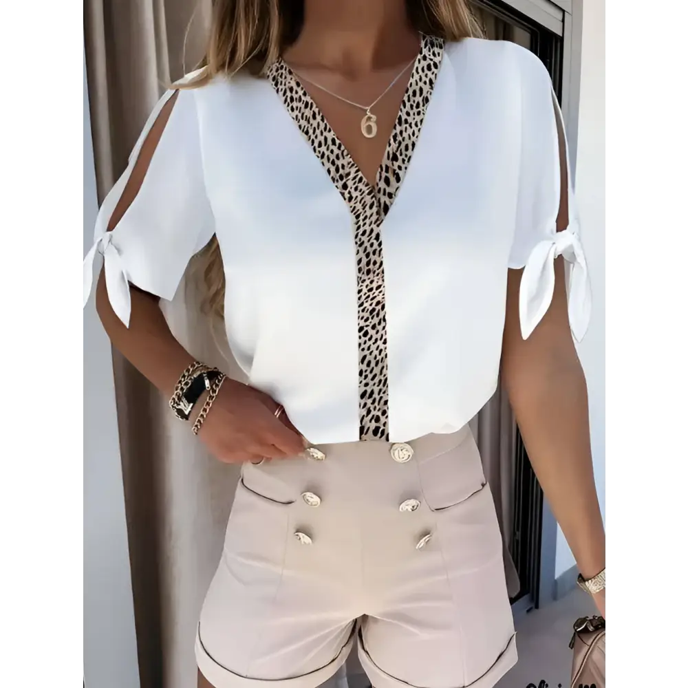 White solid color leopard print collar top with v-neckline and tied shoulder details in lightweight fabric