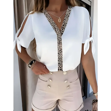 White solid color leopard print collar top with v-neckline and tied shoulder details in lightweight fabric
