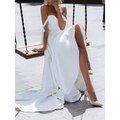 White satin strapless wedding gown with high slit and delicate bow details featuring a sexy sling design