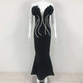 Black temperament socialite flower chain evening dress with large ruffled floral shoulders and silver beaded accents