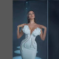 White temperament socialite flower chain evening dress in a form-fitting gown with ruffled shoulders and silver beaded sides