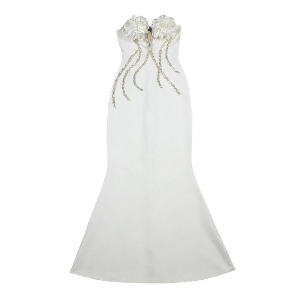 A sleek white temperament socialite flower chain evening dress with strapless mermaid silhouette and silver beaded strands