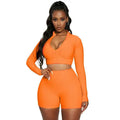 Vibrant orange tummy control two-piece athletic set with textured long-sleeve design for yoga and activewear