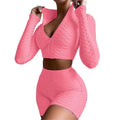 Pink textured long-sleeve zip-up crop top and high-waisted shorts set with tummy control and butt lift features