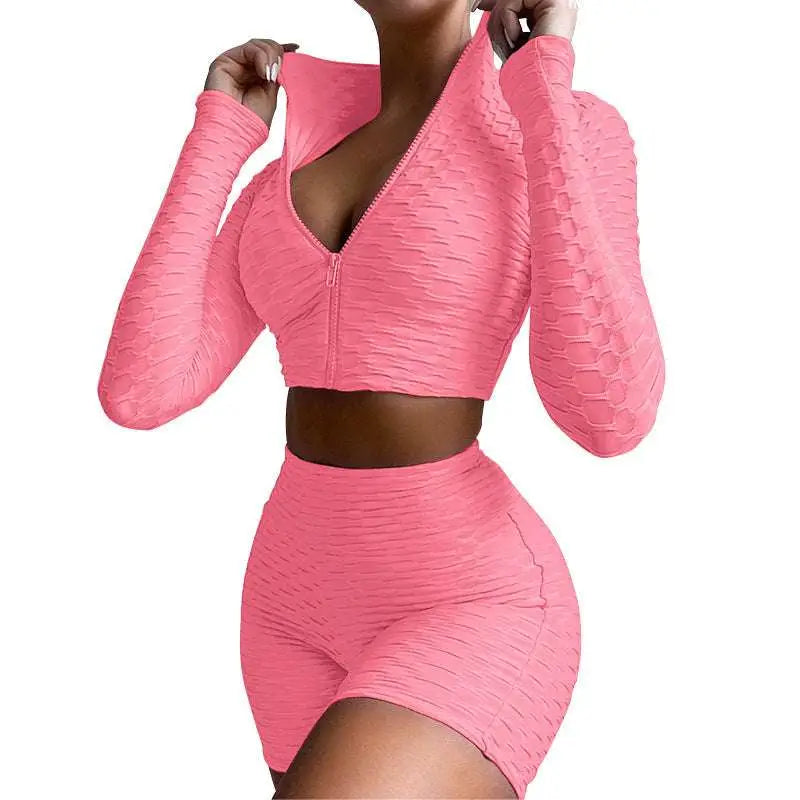 Pink textured long-sleeve zip-up crop top and high-waisted shorts set with tummy control and butt lift features