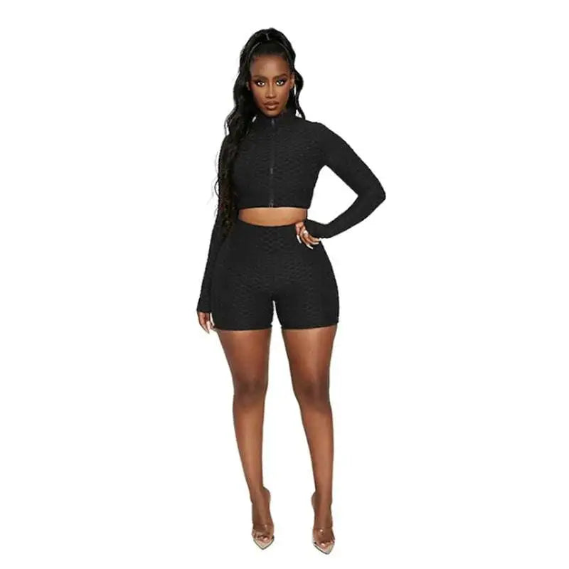 Black textured long-sleeve crop top and matching shorts set with tummy control and butt lift activewear features