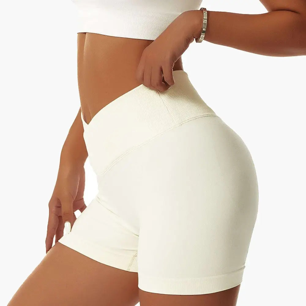 White high-waisted tight seamless sports shorts with ribbed waistband made of seamless fabric for athletic use