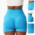 Bright blue high-waisted tight seamless sports shorts with ribbed waistband and ruched back design displayed from back side