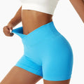 White tight seamless sports shorts in bright blue featuring a high-waisted tight seamless fit with ribbed waistband and leg openings