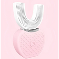 Pink heart-shaped ultrasonic electric toothbrush with white u-shaped brush head and silver accents automatic tooth cleaner