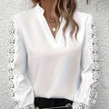 White v neck blouse with lace patchwork long sleeves featuring delicate lace detailing and soft flowing fabric